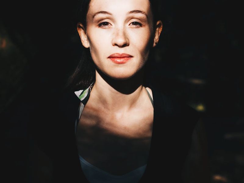 Person doing eye exercise in front of a window